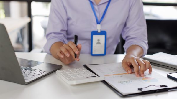 close-up-of-business-woman-or-accountant-hand-hold-2024-09-24-04-27-37-utc