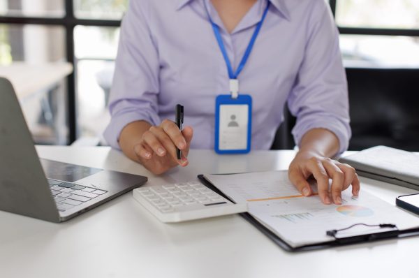 close-up-of-business-woman-or-accountant-hand-hold-2024-09-24-04-27-37-utc