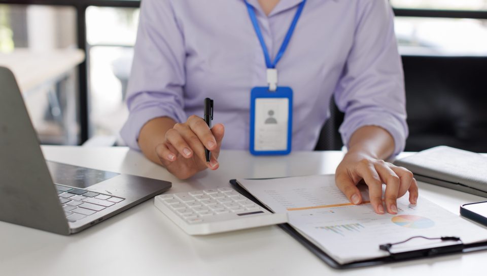 close-up-of-business-woman-or-accountant-hand-hold-2024-09-24-04-27-37-utc