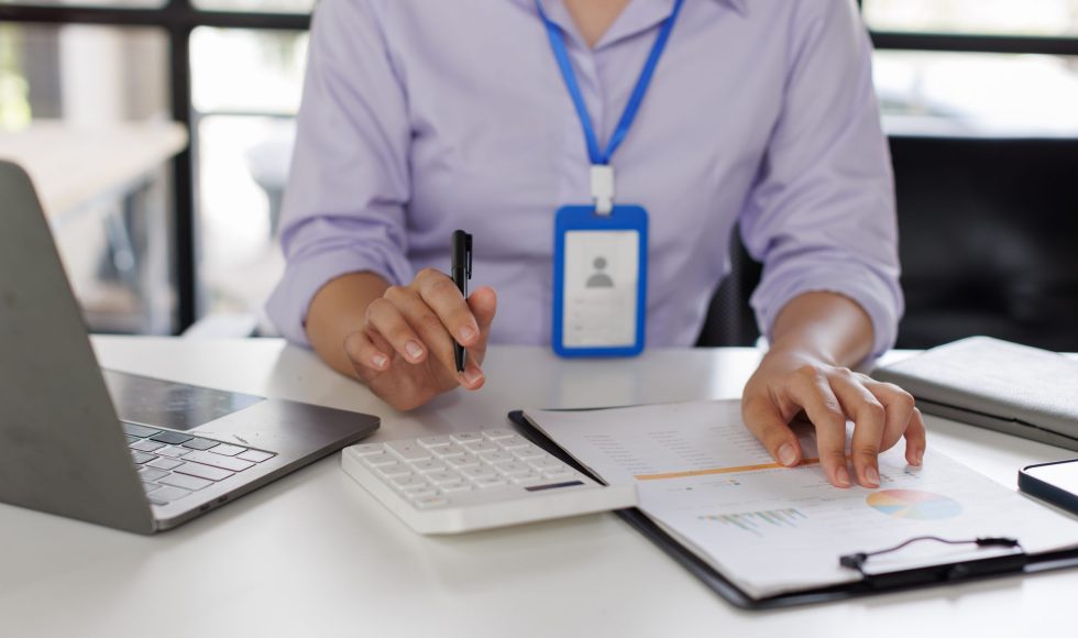 close-up-of-business-woman-or-accountant-hand-hold-2024-09-24-04-27-37-utc